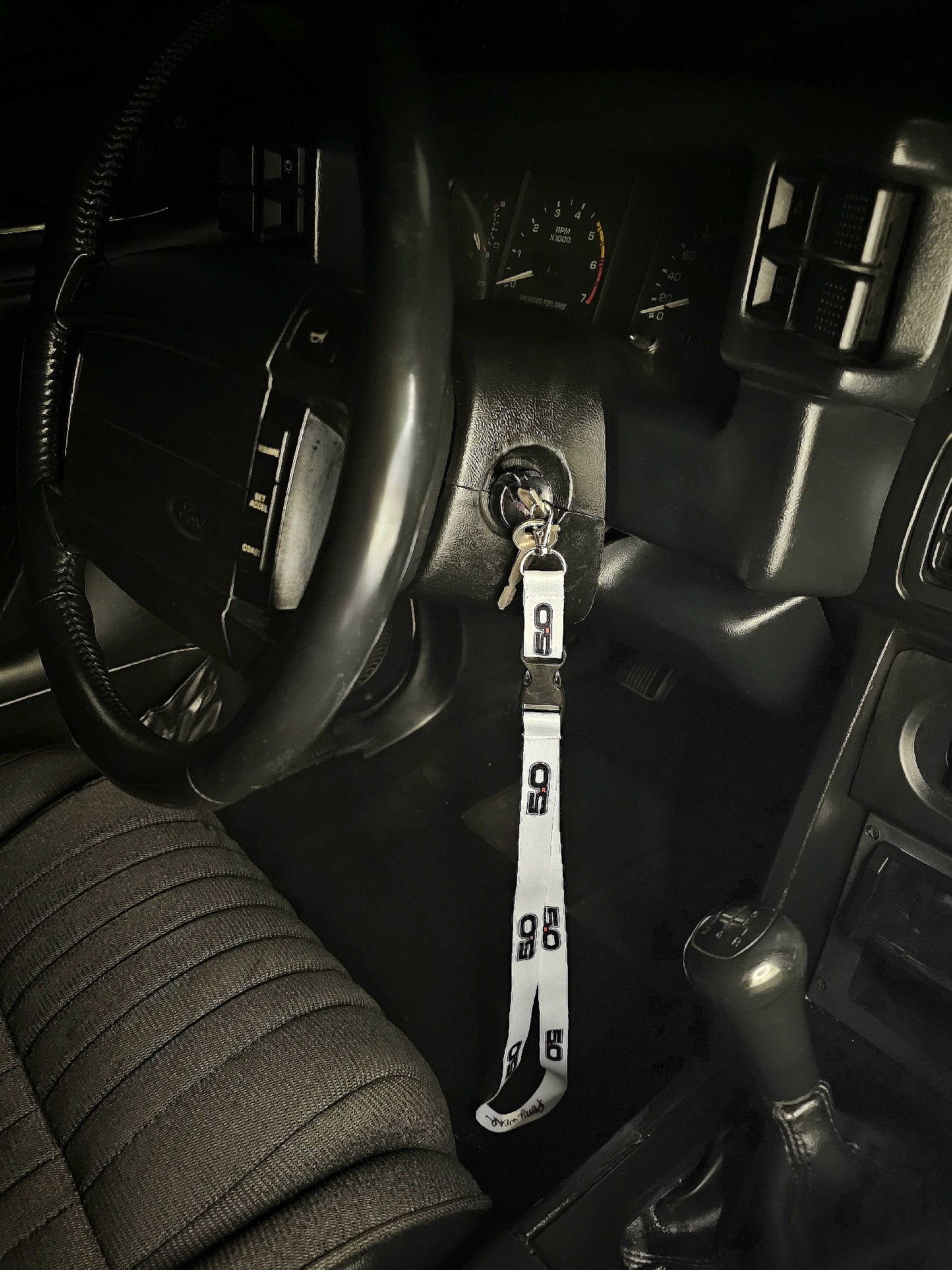 Ford Mustang Foxbody Lanyard key chain custom design gift perfect for holding keys or attaching to a back pack. Makes for a perfect gift for your husband, wife, girlfriend, boyfriend, etc. Built with you in mind. Featured in a 1990 Foxbody Mustang, the lanyard hangs from the ignition.